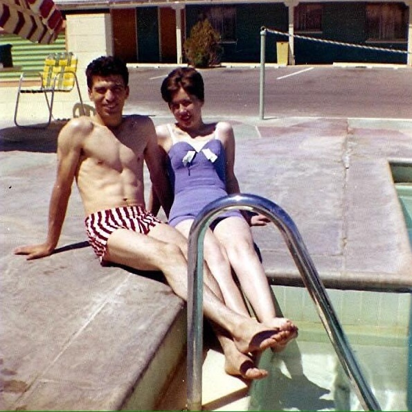 Mom & Dad showing off by the pool!