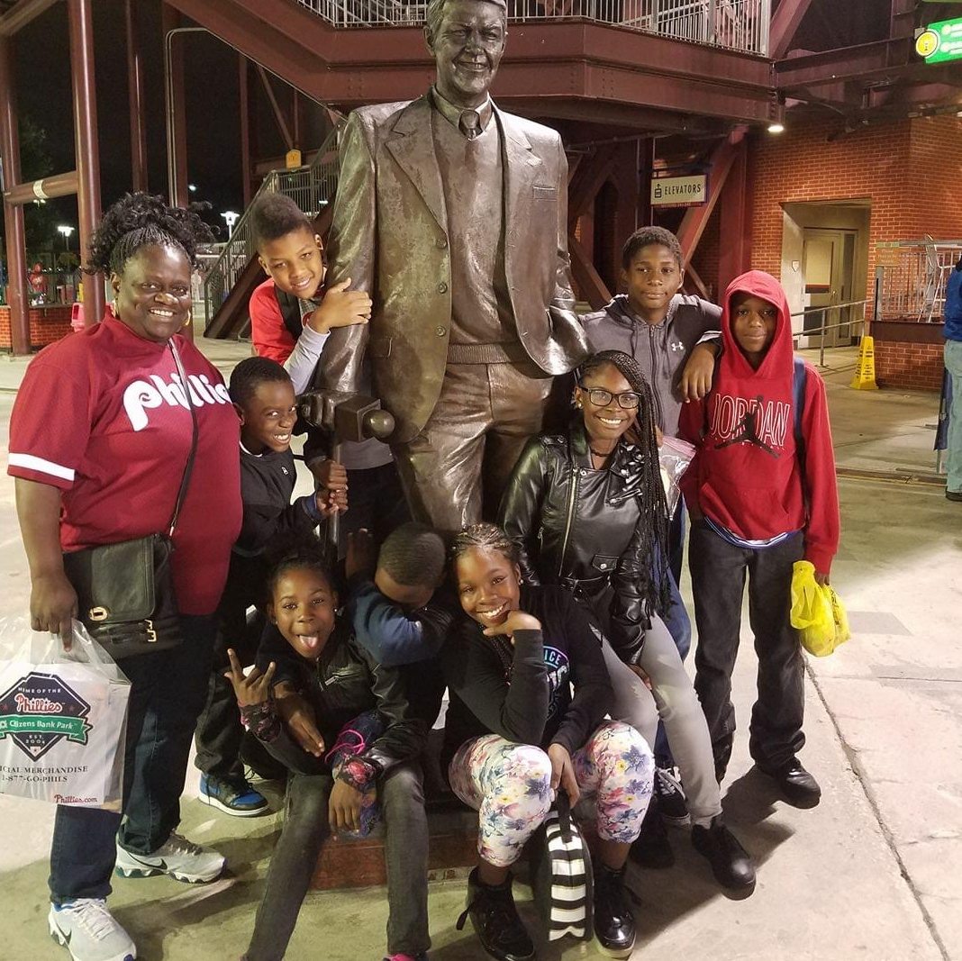 Daphne taking kids from her block to the Phillies like she always did 