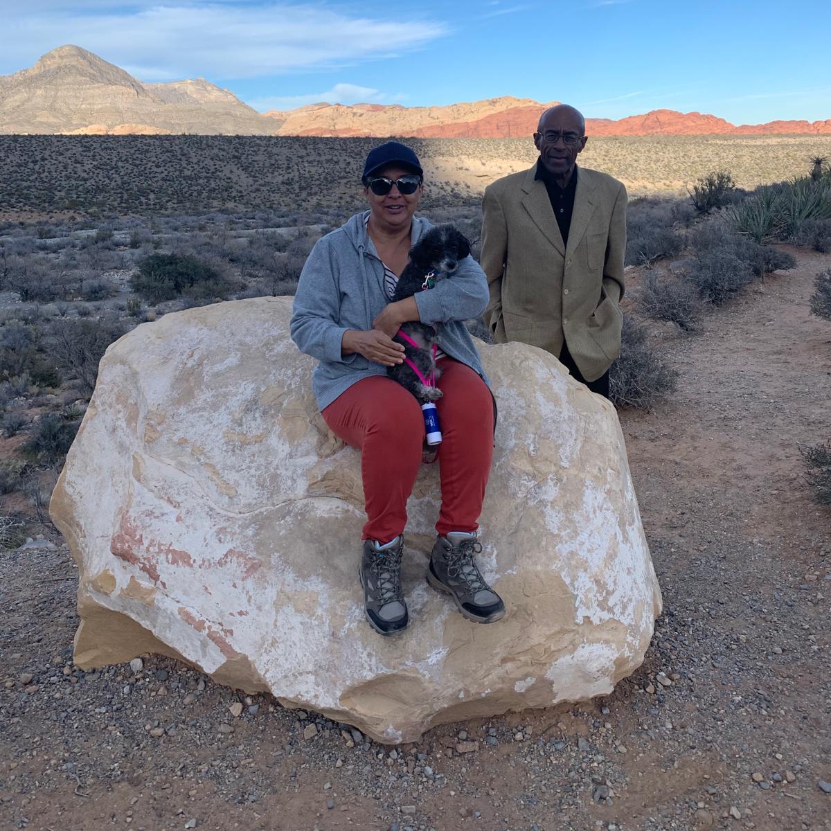 Here is my dad with mom, out enjoying a walk in vegas. My mom holding her dog leo.