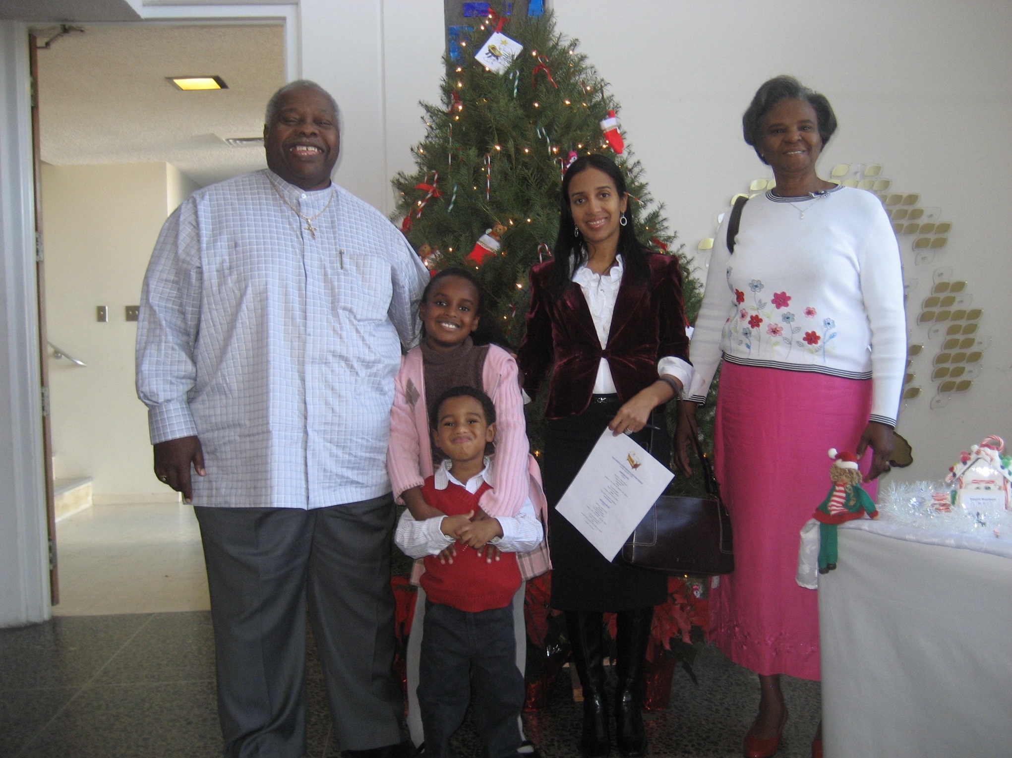 Cabrini, Mr. March, and Mrs. March with Cami and Glen III ready for the holiday school festivities. Thanks for always being there, Pops!