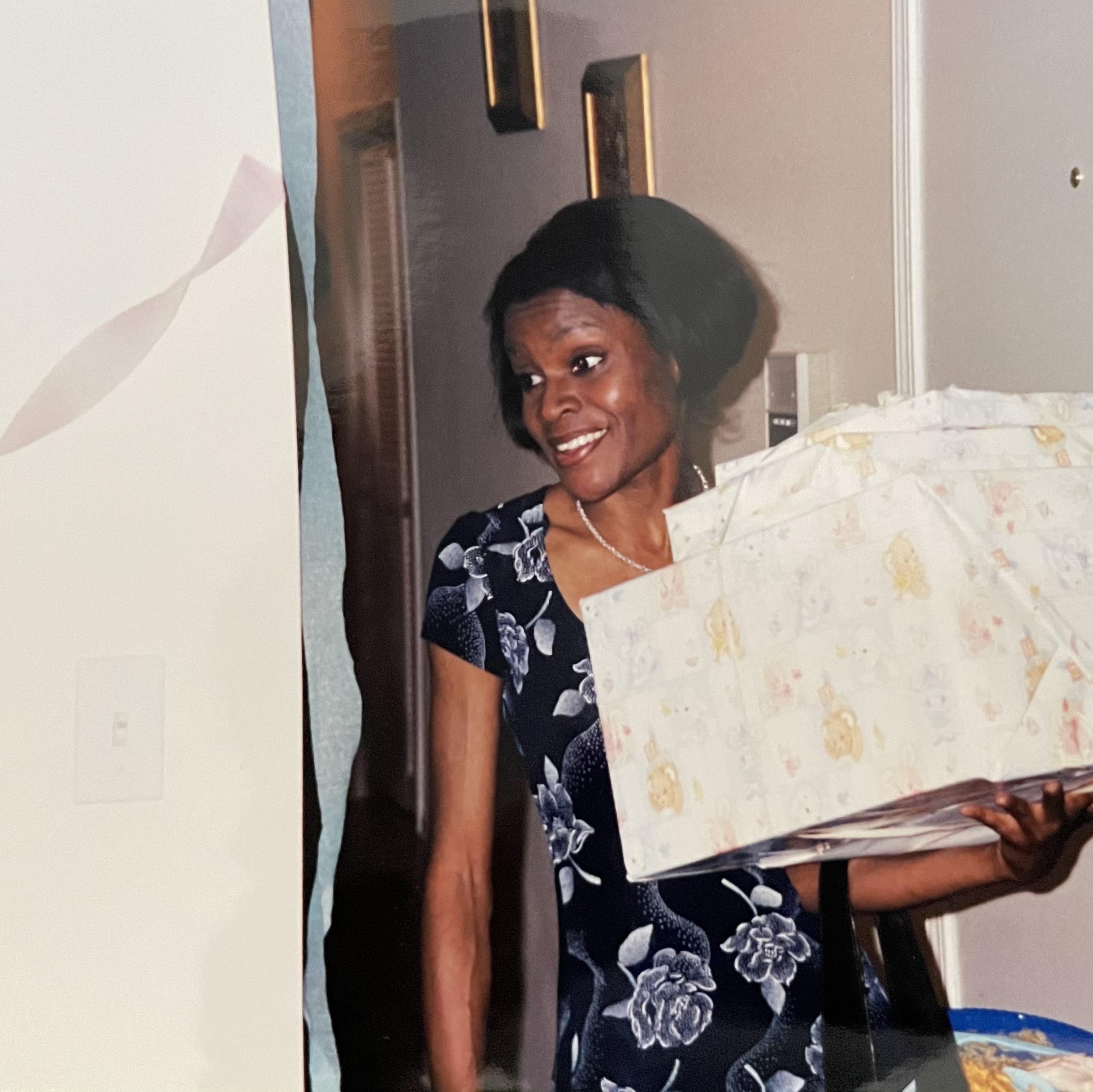 Kelli at my baby shower with gifts in hand