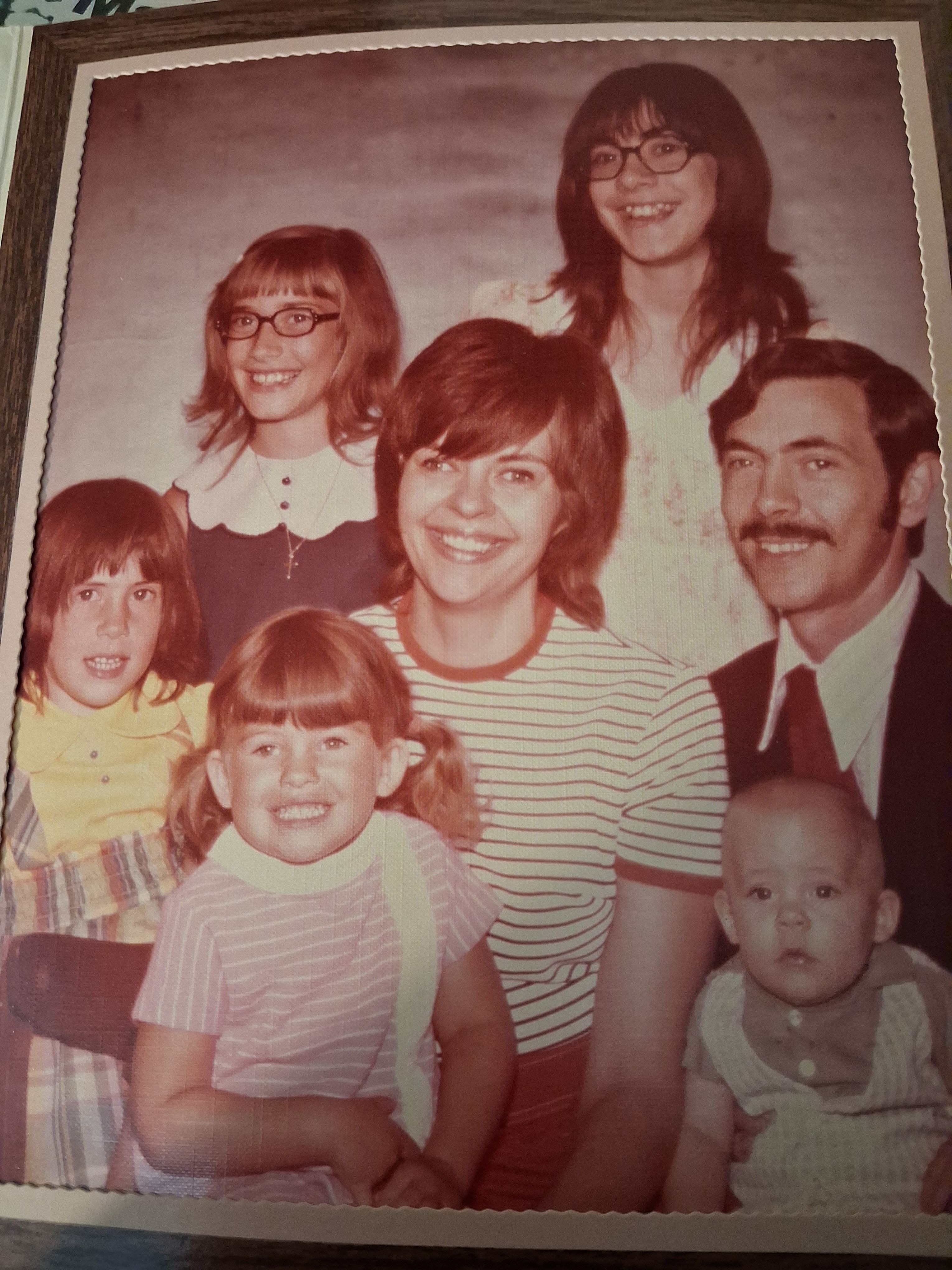 This is family picture of mom, dad, and us kids