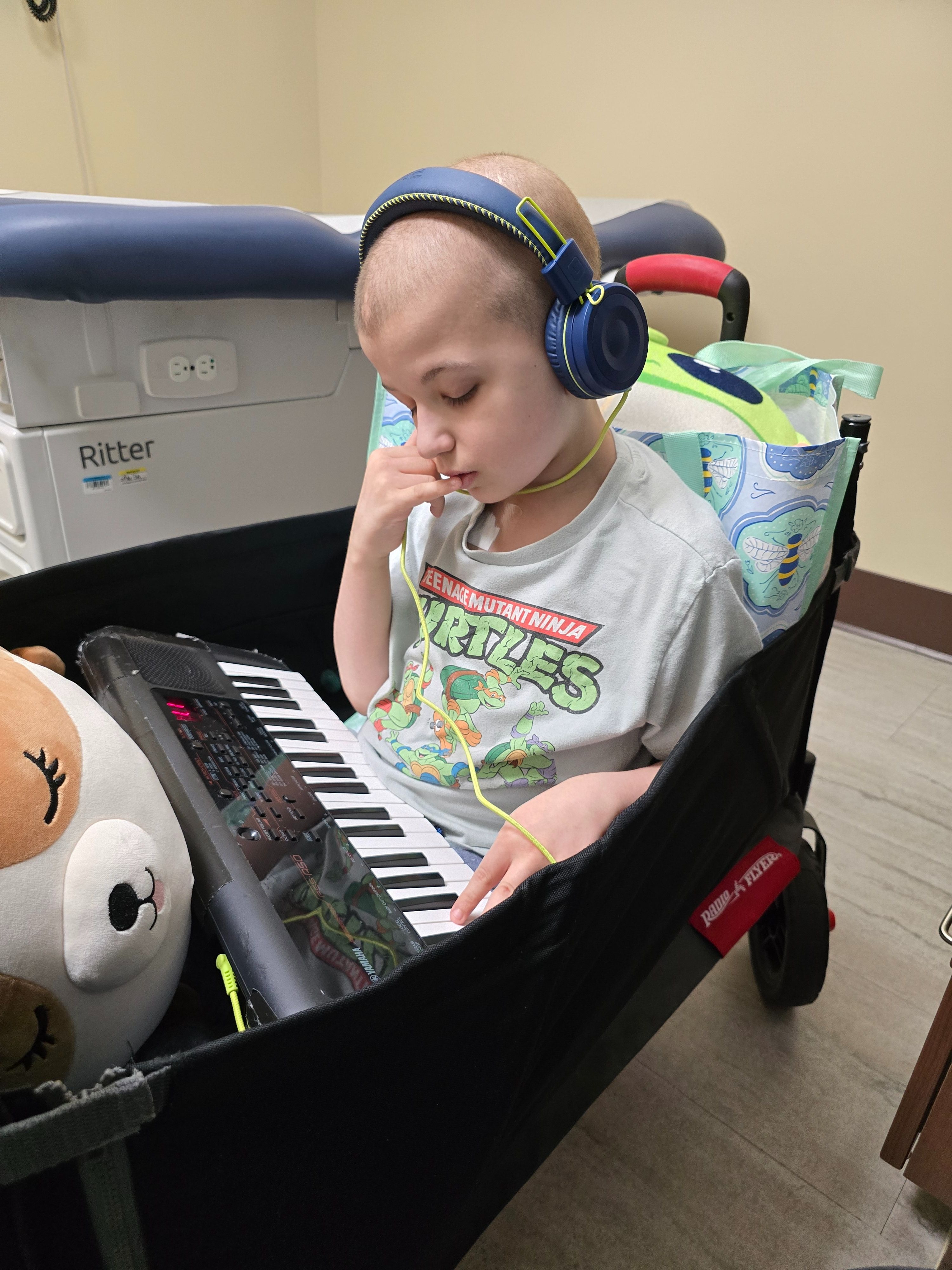 Having a jam session on his piano while traveling in the wagon at the hospital