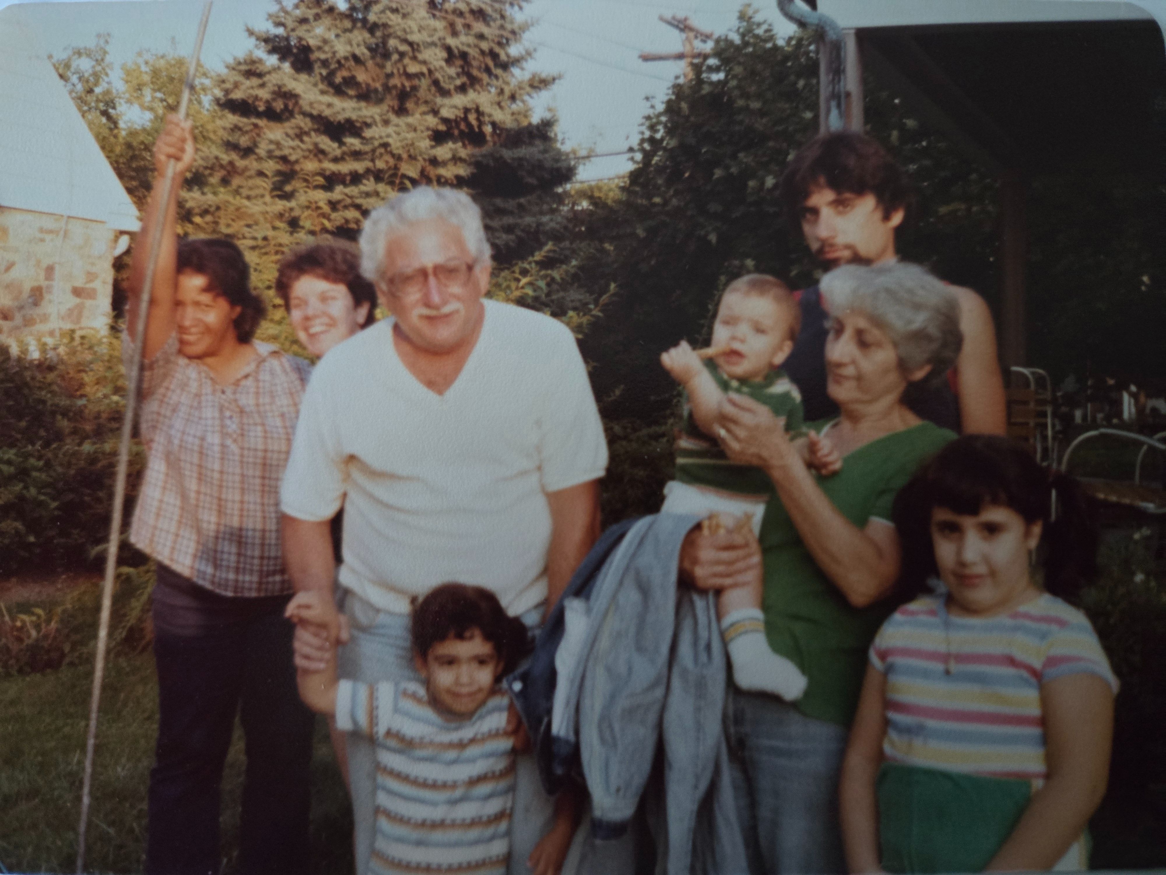 Left to right: my Mom, Susan, my Dad (Lydia's brother), Baby Fiore, Aunt Lydia, and Fiore. In front of my Dad is my sister, Anna, and I am to the right. 