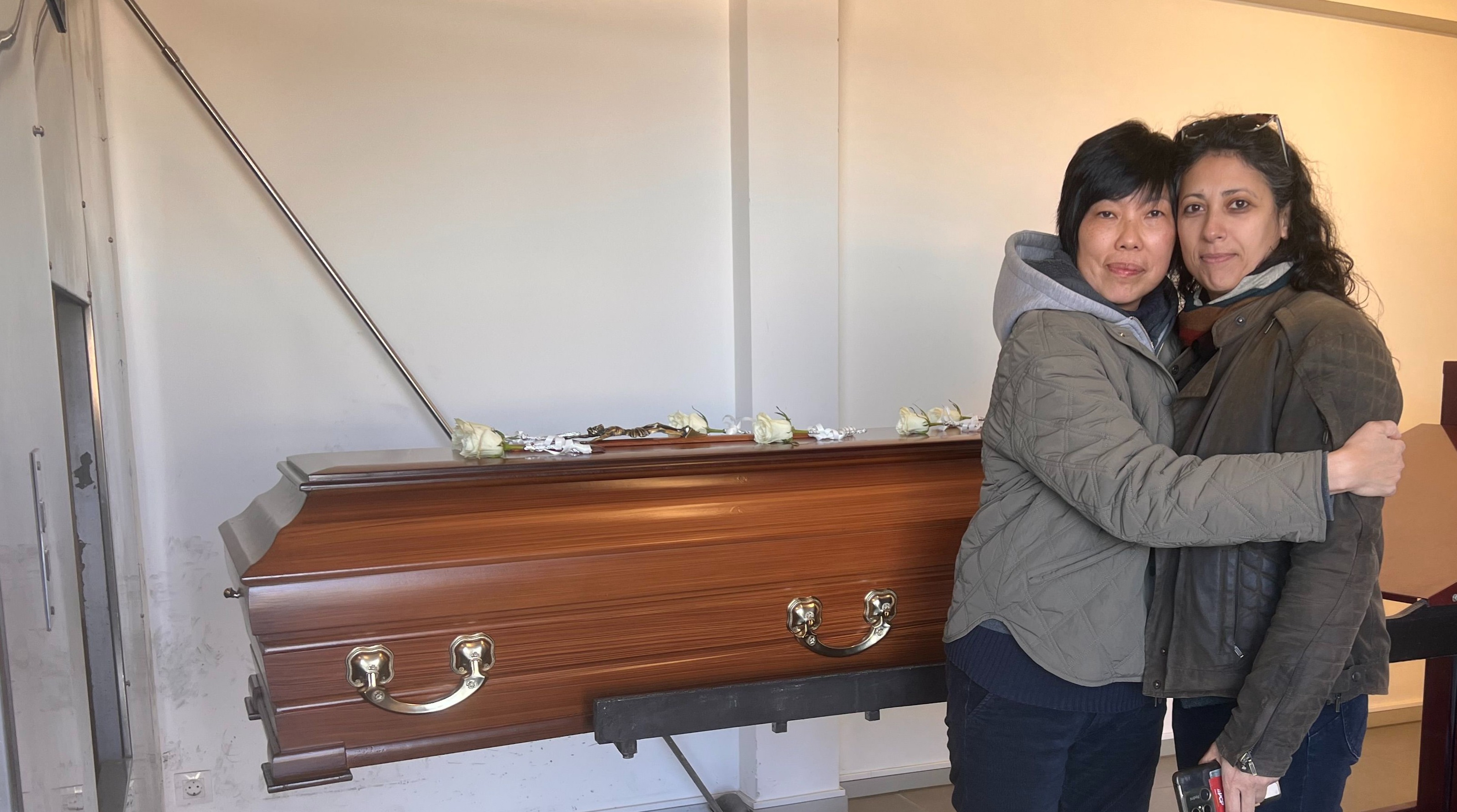 A loving hug and moment with Mum — Catarina and I beside her casket.