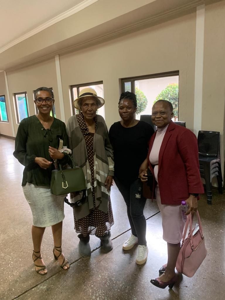 Gogo at church with her daughter, and some of her church family.