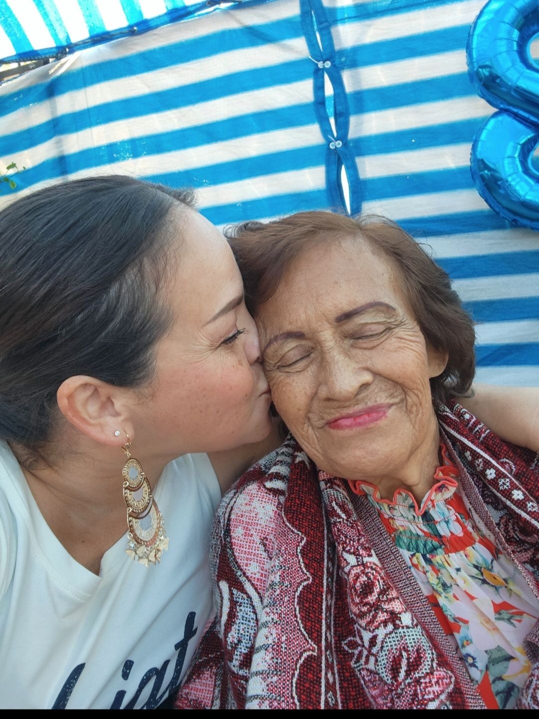 Mami and I at dad's 80th birthday. 