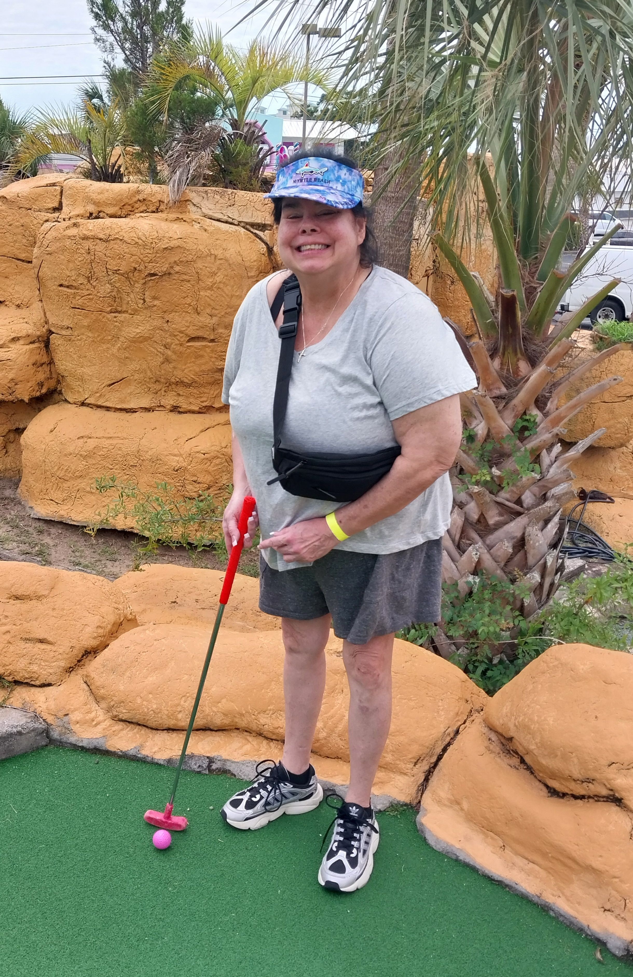 This photo was taken at Myrtle Beach playing mini golf. I believe she one this round. Her prize was "all you can eat" crab legs.