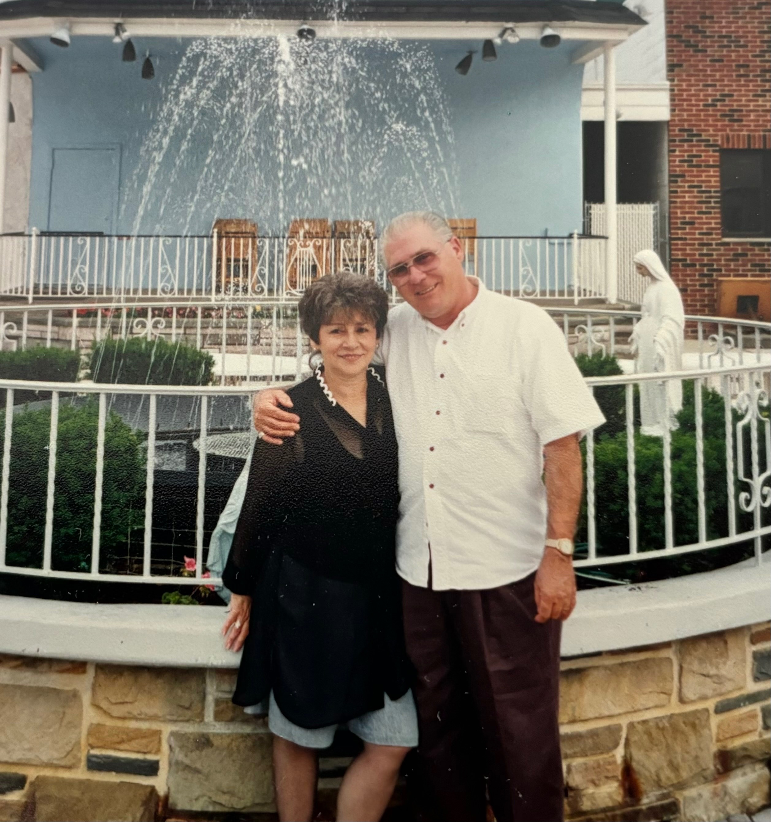 Betty & Rocky in Front of the fountain at the Overbrook Club
