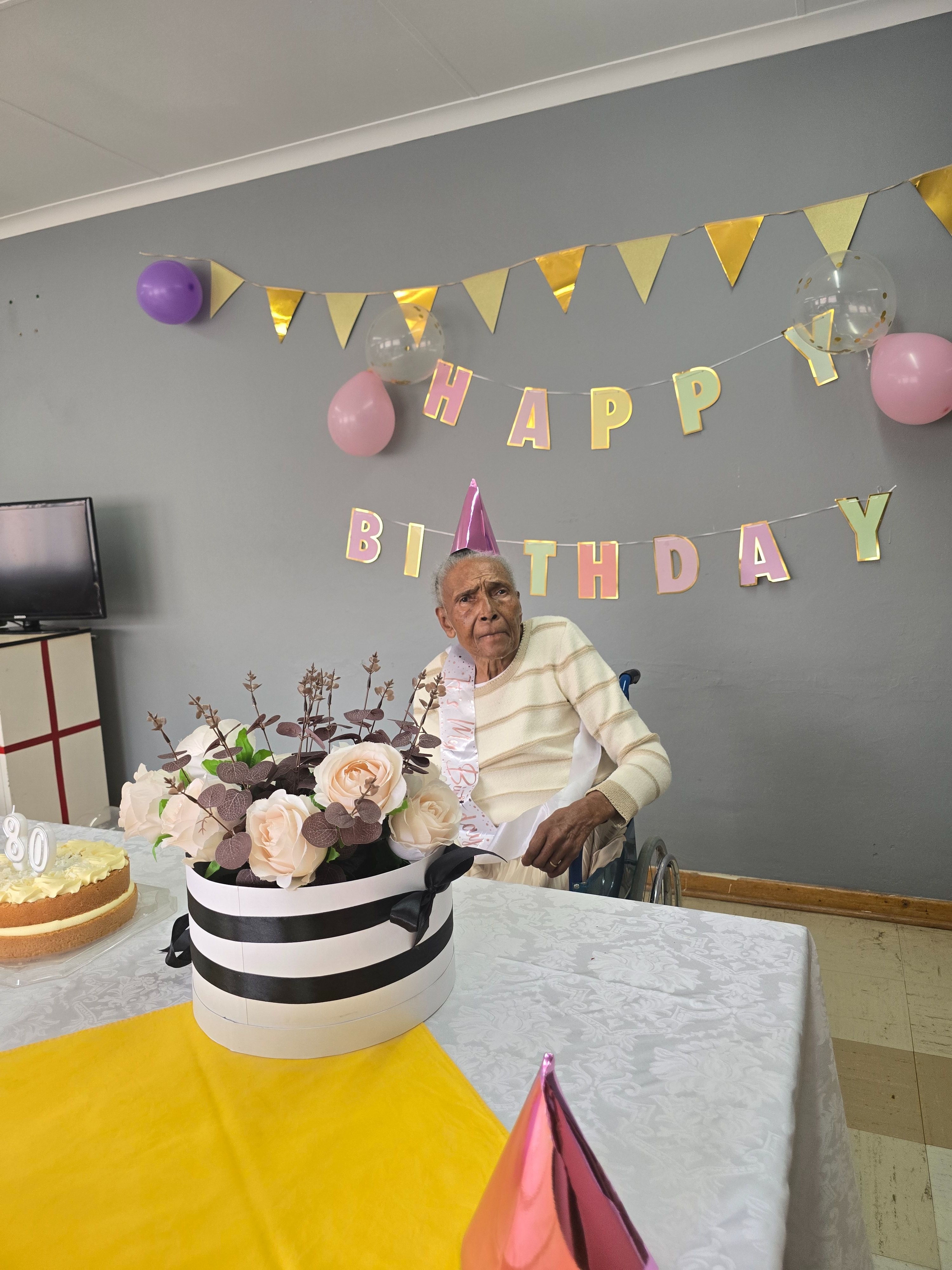Gogo celebrating her 80th birthday at SAVF Cosmos old age home.