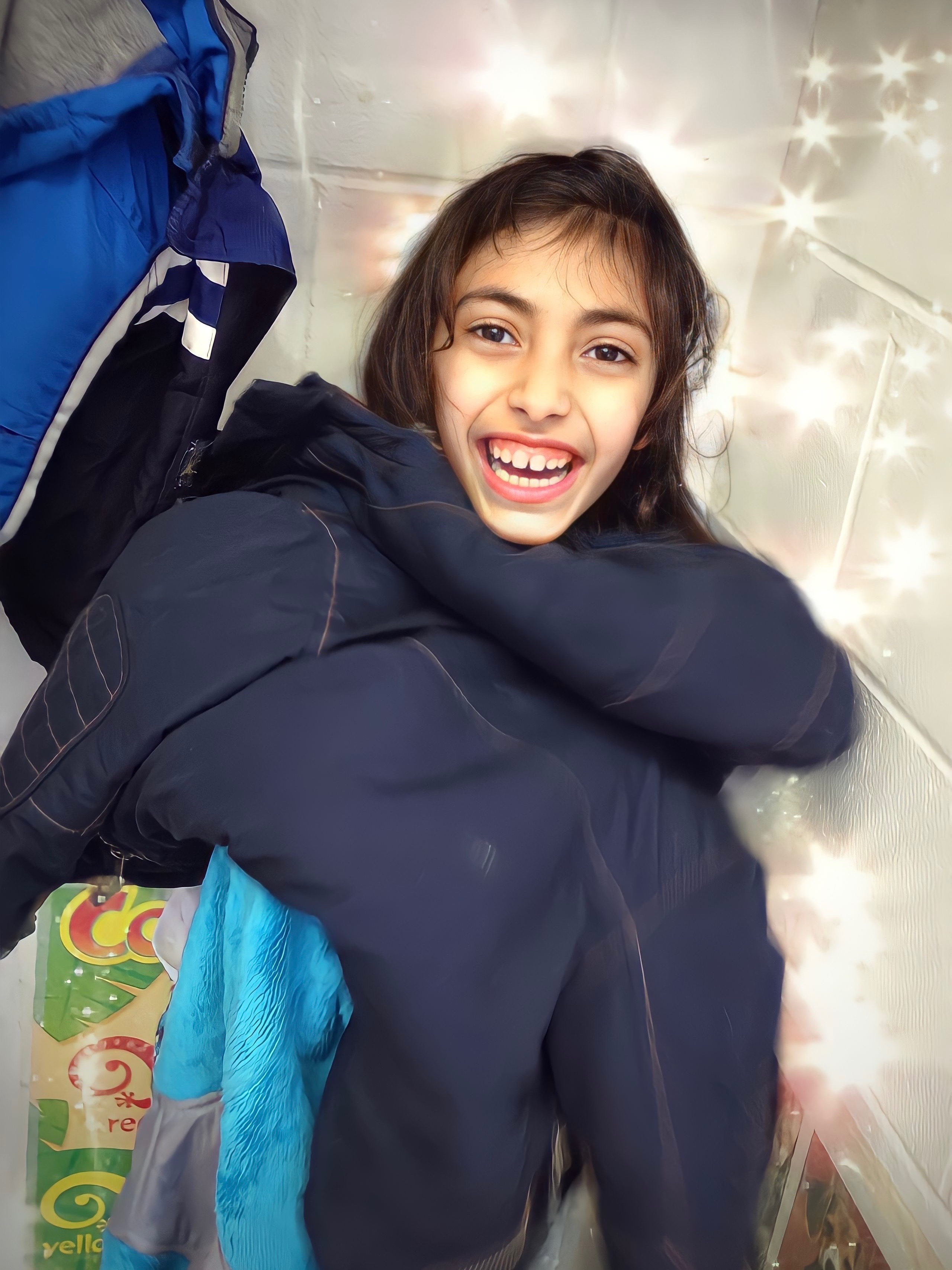 From 2014. Maisa used to hide in my room at work, covering herself with little children’s coats and backpacks. Naima would come in, pretend not to see her, and tell me about all the homework someone still needed to do. After she left the room, Maisa would pop out grinning, always sure she’d fooled her mom!