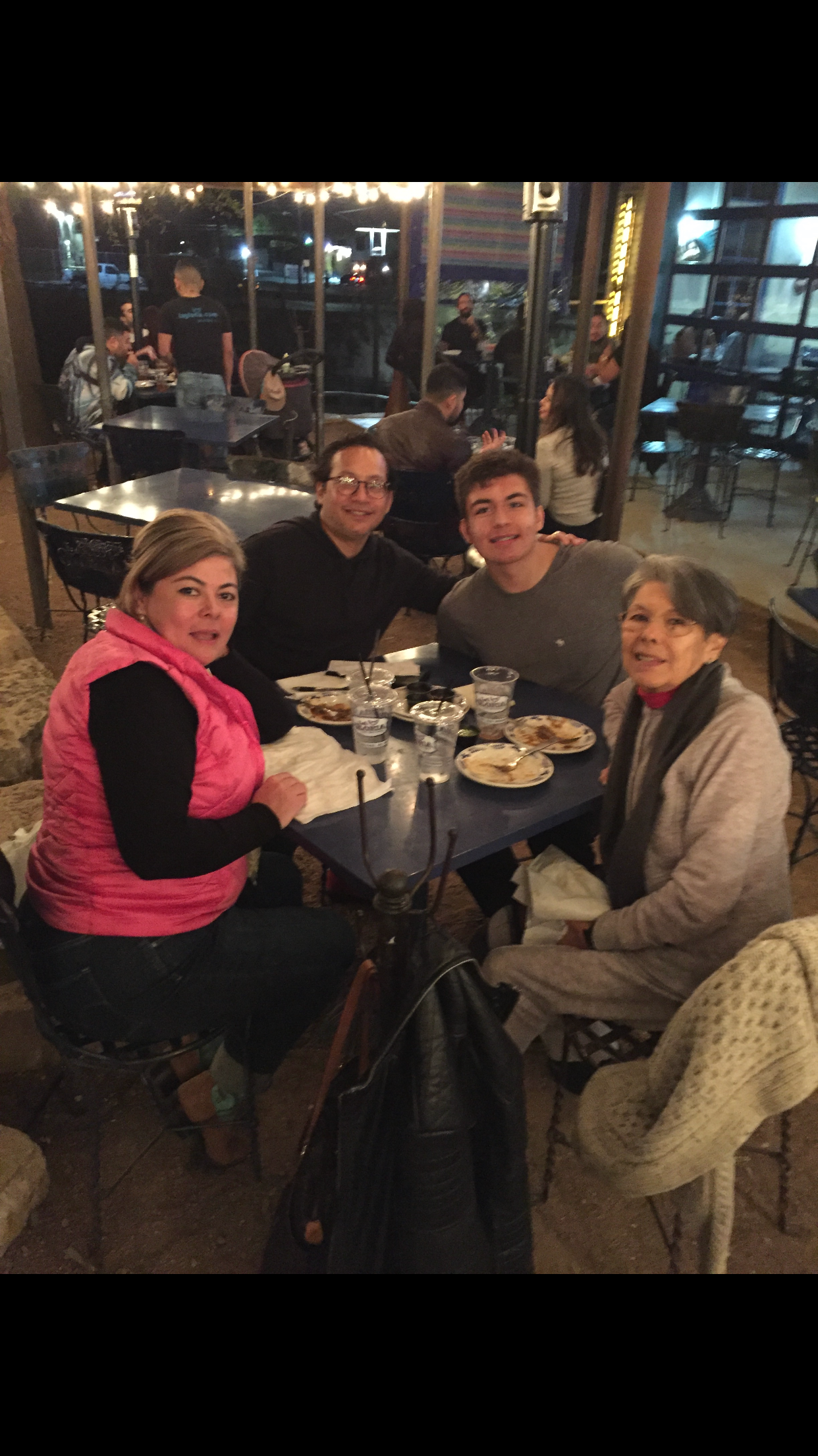 Gloria enjoying dinner with Maury, Rick, and Atreyu