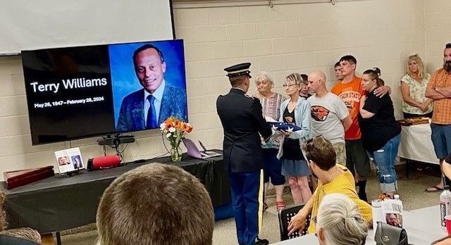 Honor Guard Flag to Kathy. Thanks Terry for your service to America!
