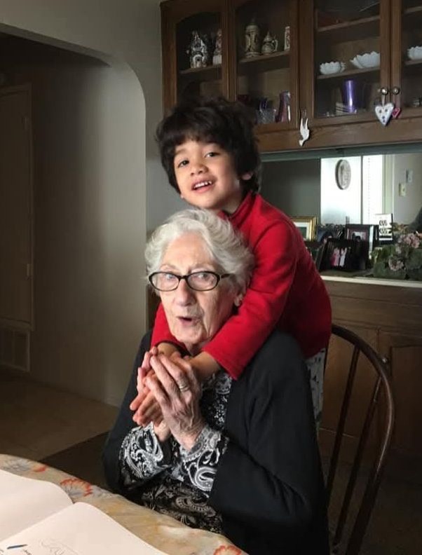Great grandson, Zephyr surprises Nonna with a hug.