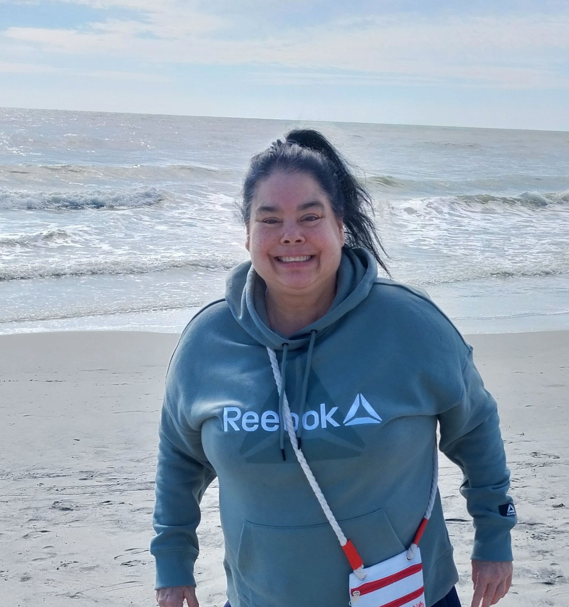 Even if the temperatures were cool she still loved walking along the shore looking for seashells.