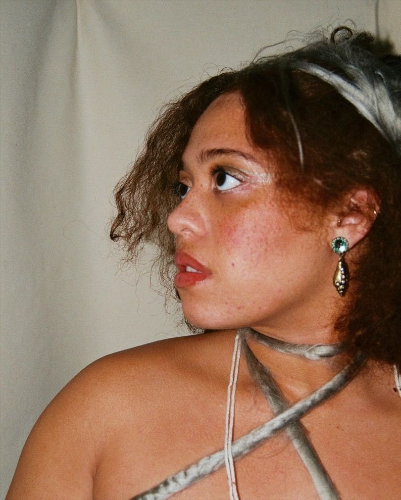 I loved photographing Kyra. Her doe eyes, striking hair, and beautiful smile made her an easy muse. this photoshoot we were going for an ethereal earth fairy look using yarn