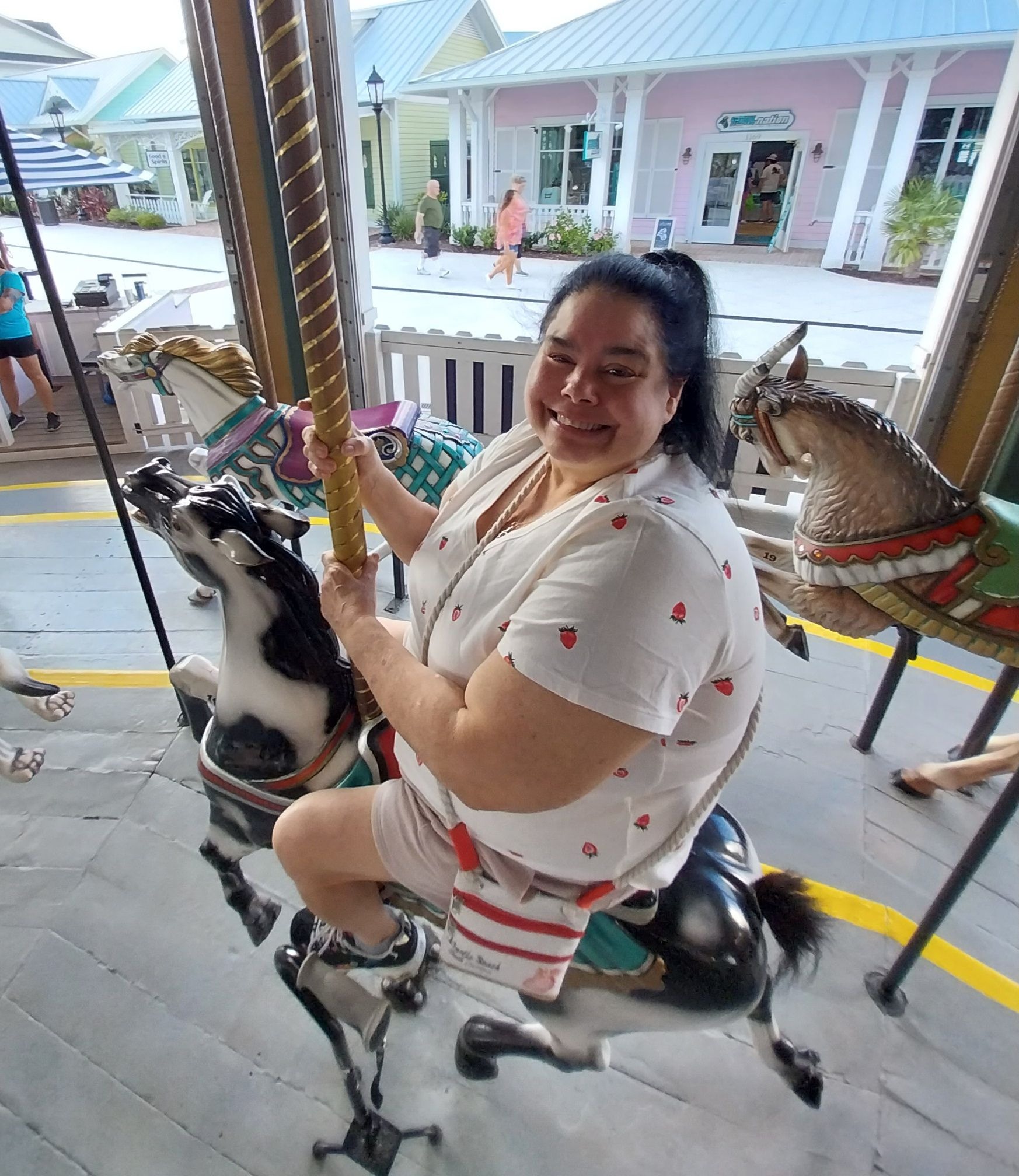 Elizabeth at Broadway at the Beach in Myrtle Beach riding the Carousel. She was so happy going around and around here. A beautiful moment.