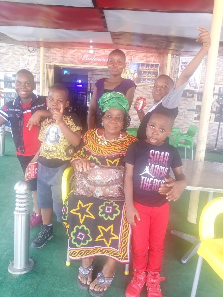 Mana with some of her grand-children during the child dedication of one of her grand-daughter, Chimamanda.