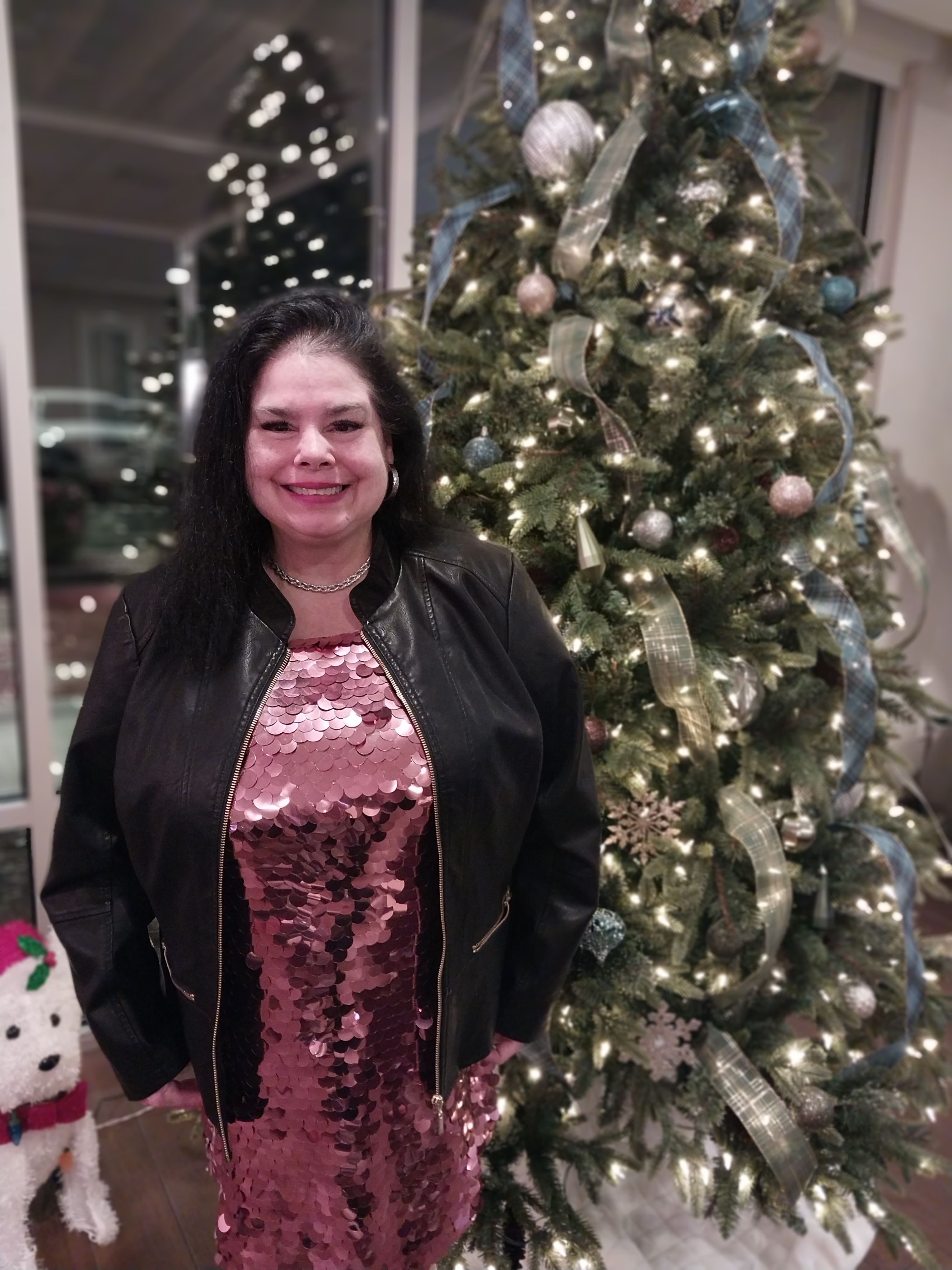 Elizabeth loved getting dressed up for special occasions and here she is at a Christmas party. We looked everywhere for the dress she had in her mind and when we found it she was so excited. She is so beautiful.