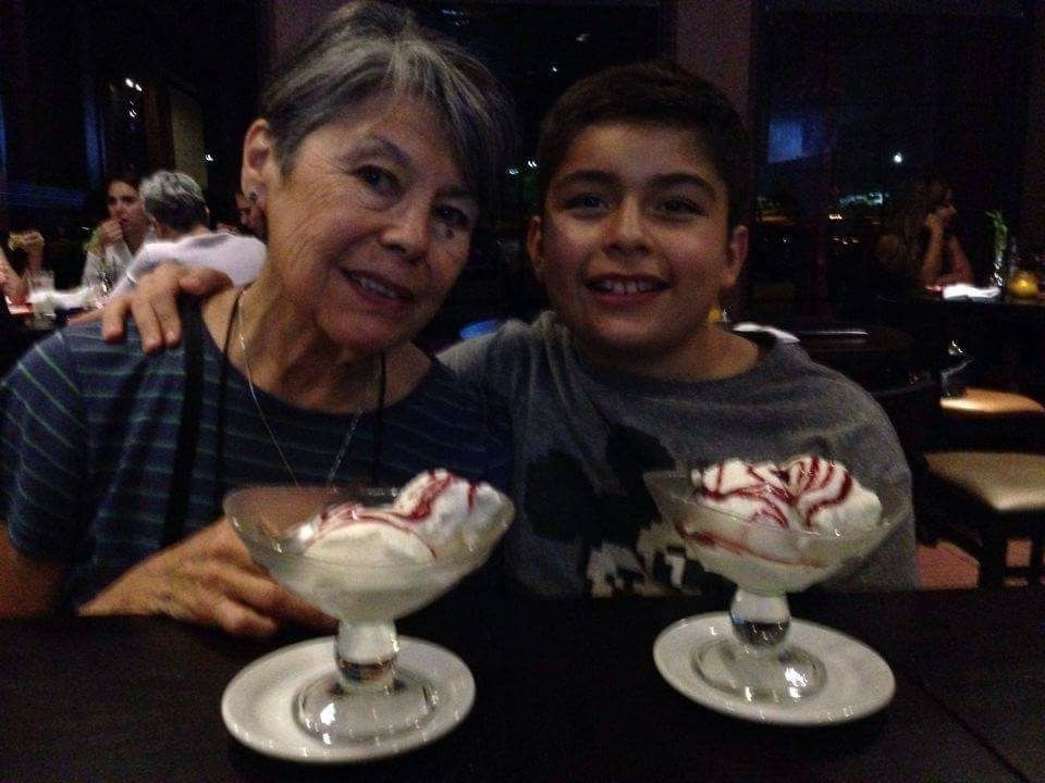 Gloria enjoying desert with her grandson Atreyu