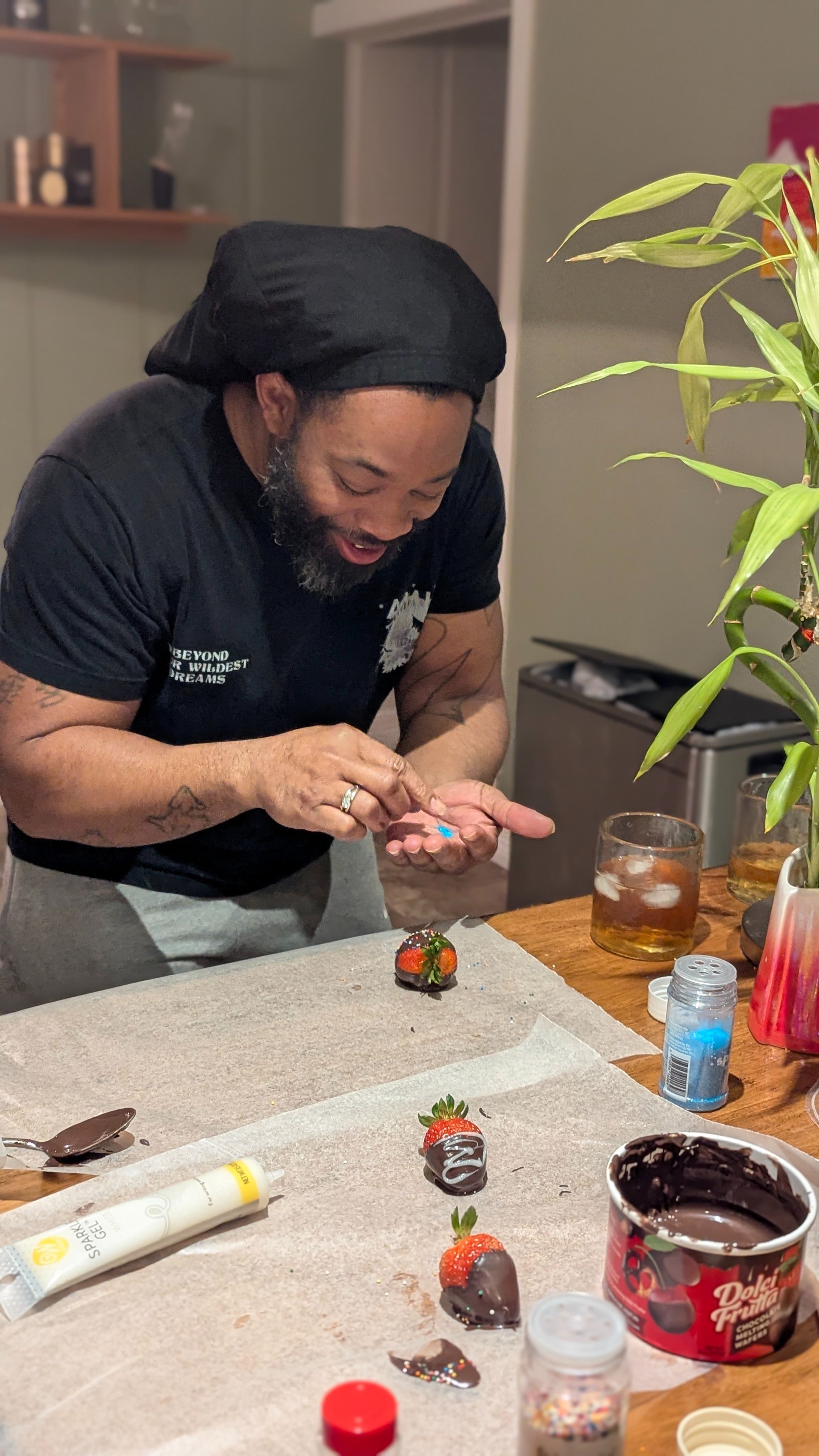 Making chocolate covered strawberries.