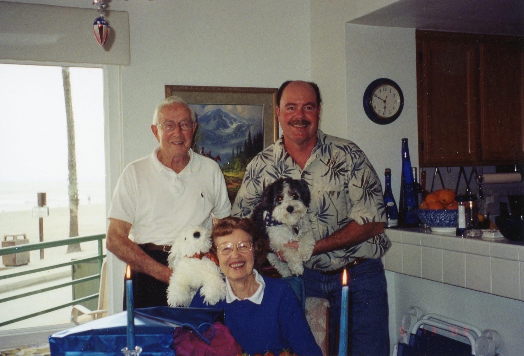 In Don & Kay's home in Oceanside. I'm pretty sure, knowing Del, that the dog Angelo is holding on her shoulder is stuffed! Ha!