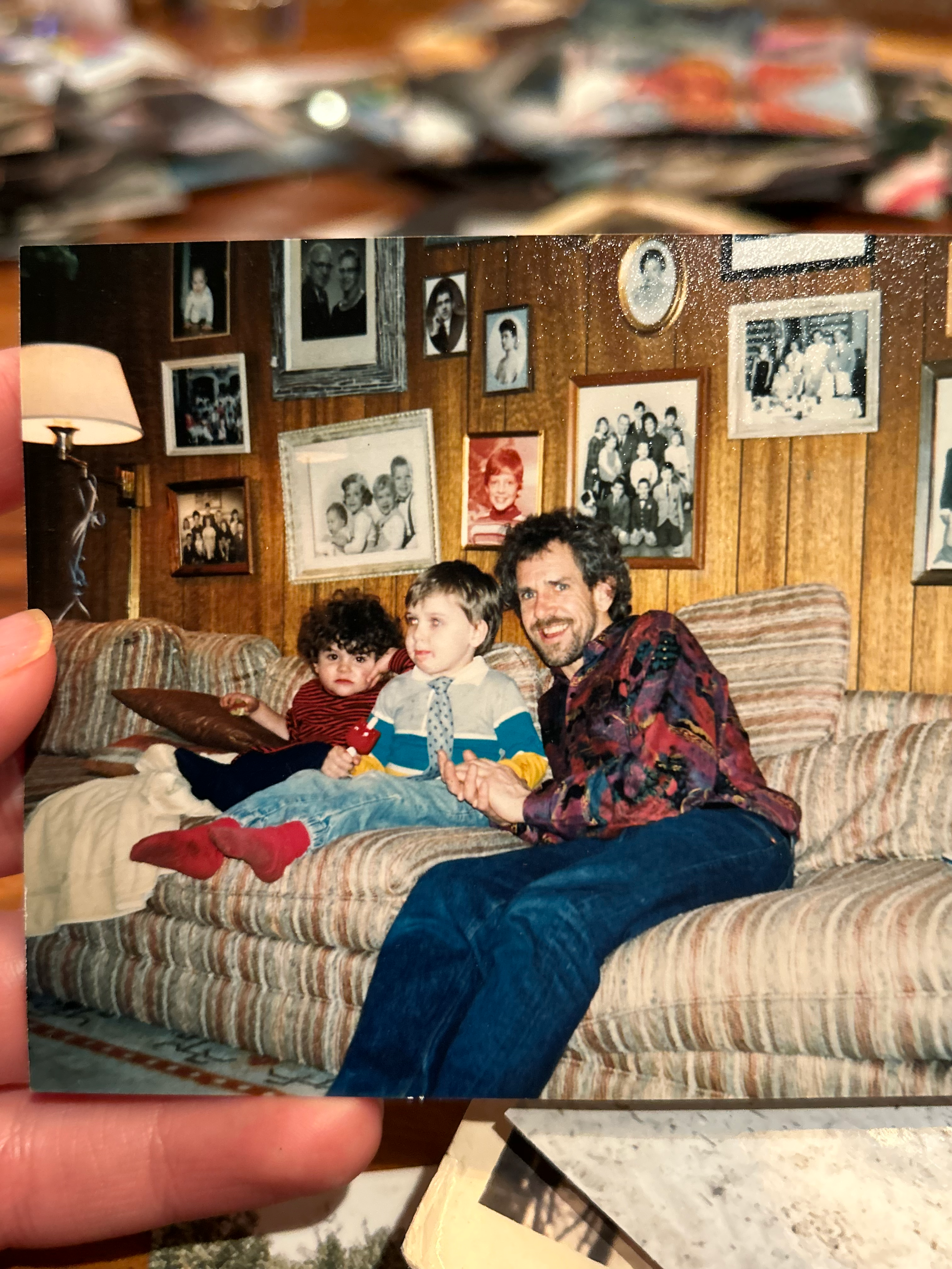 My dad was my biggest hero. He taught me so many things about life and living. He taught me the skill of carpentry. He taught me how to be a musician and audio engineer. He taught me the value of hard work. The value of living healthy. The value of family and community. The value of finding humor in every situation. The value of seeing the goodness in everyone. He taught me how to be a good man, not just in strength but in gentle kindness.
He had the biggest, warm energy and always greeted people with enthusiasm and excitement. His smile was infectious. He loved to share stories of his adventures, which tended to gain more embellishments at each telling. He loved his wife and kids immensely, and was so proud to have met his first grandchild.
In addition to mourning him, I also mourn the music and bands we played in together. From world beat band Bongoville, to Indian devotional music, to bringing back the acoustic Bijou Link songs, to the touring reggae band The Wicked Hangin Chads (later, The Indelibles), and numerous other projects. We spent thousands of hours together in rigorous rehearsals and recording sessions, where my dad would push all the players to perform at their absolute best. He knew what we were all capable of and had a clear vision of what the music should sound like. Then when we would get on stage all we had to focus on was locking in and having fun.
Dad was tenacious and knew what he wanted. And was unapologetic about following his dreams. Once he had his mind set on doing something it was very hard to deter him. He always talked about taking the reggae band on tour to the west coast. And he did, twice. He always talked about fully renovating our childhood home and selling it. And he did, almost singlehandedly. He always dreamed of moving out to the west coast, buying a property with land, and building a stage on it to perform on. He did just that. That drive to reach for those dreams, against difficult odds but with a bit of divine luck, was so inspiring to me.
He’s not here in the flesh anymore. And that makes me grieve for all the future memories I hoped to make with him. But I know he’s with me in my heart, in the hearts of all those he touched. That big, warm energy can live on through us. The qualities of tenacity, humor, enthusiasm, zest for life, kindness, optimism, and overflowing love for family and friends are lessons we can all take with us into the future. That’s what he would want. He would want us to keep spreading the love, making music and magic, keep dancing and making memories with those we love. I know he’s up there, playing a celestial stratocaster, smiling down on us. Fly on Papa, we love you!