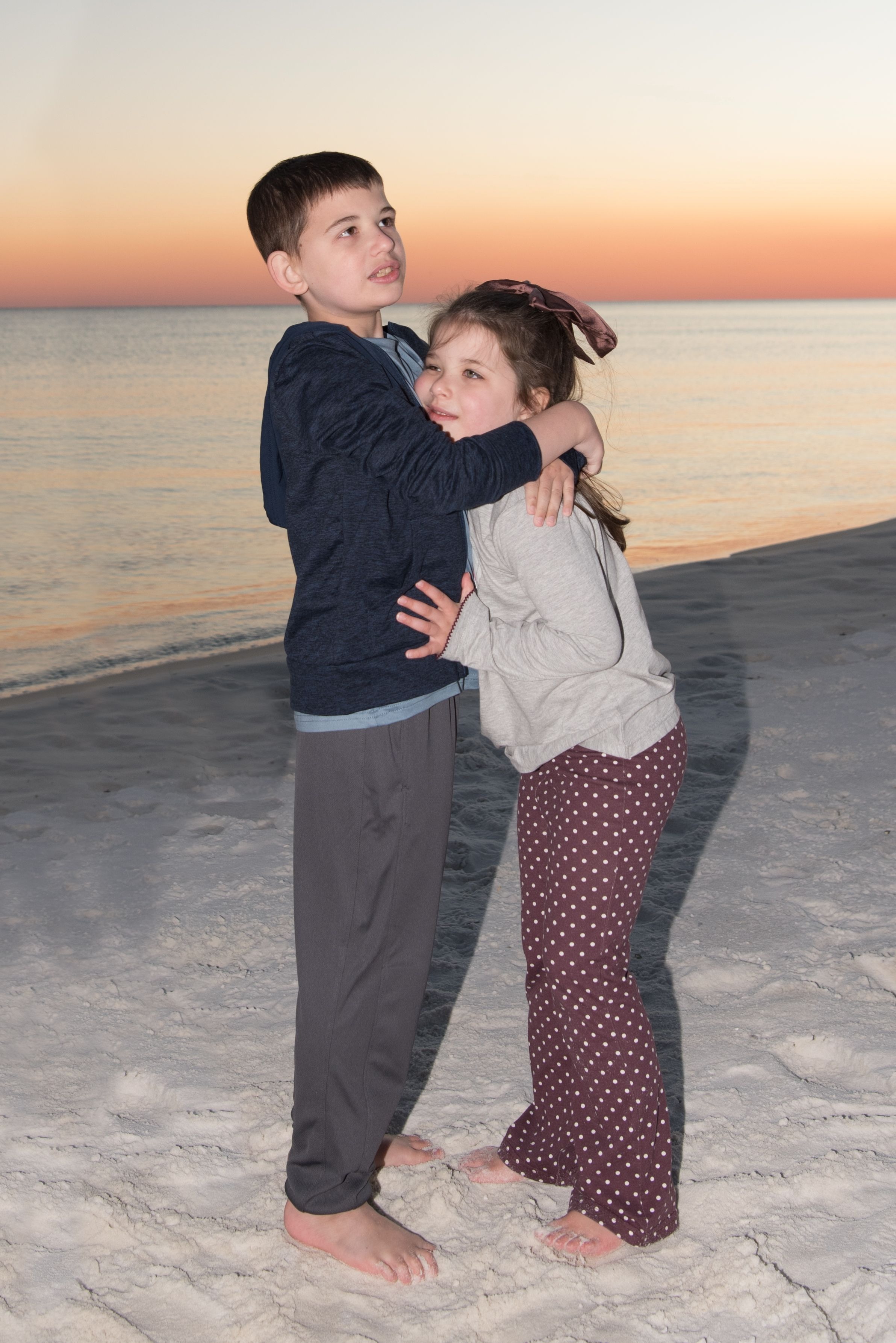 Brother and sister hugs