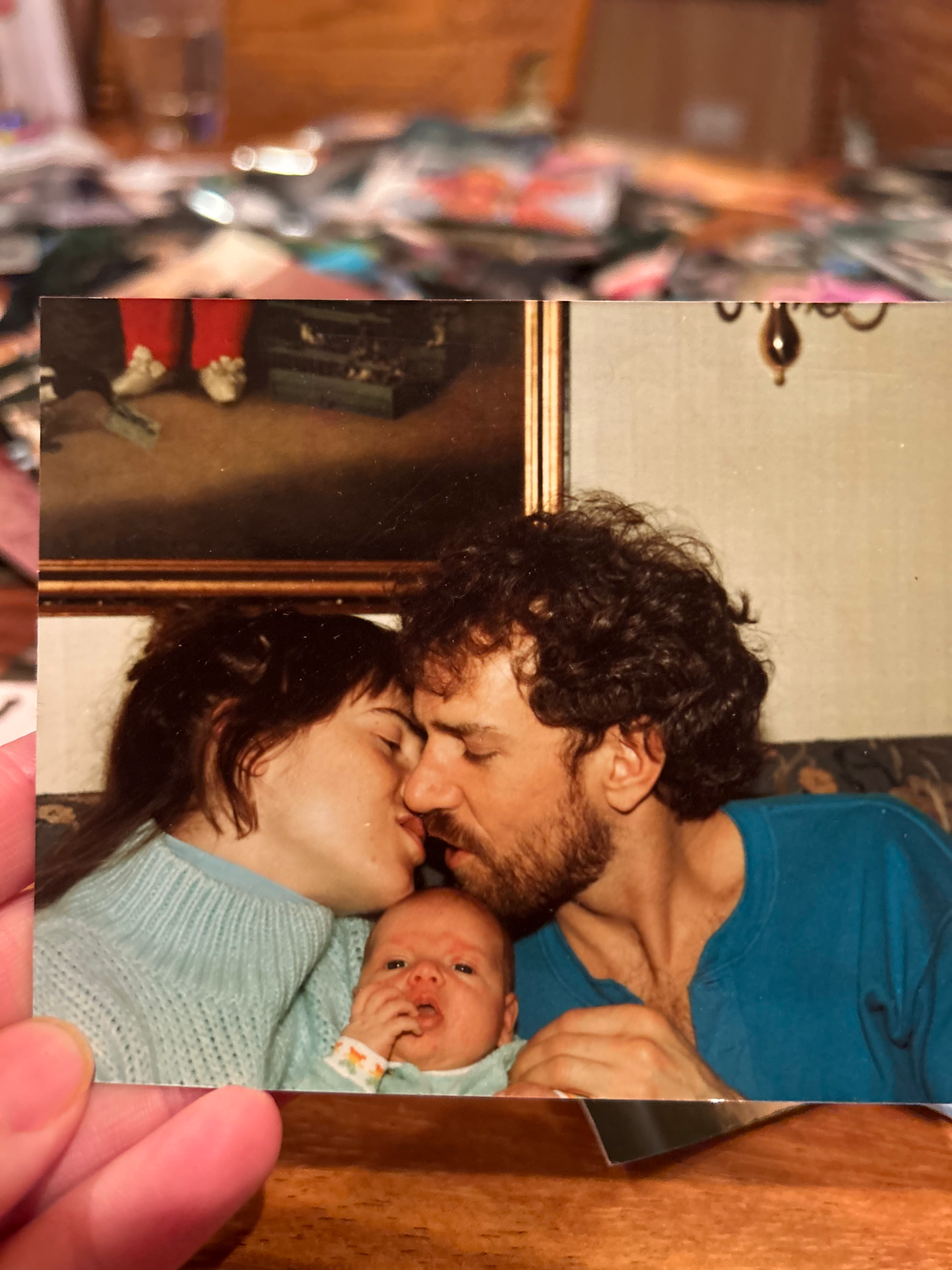 My dad was my biggest hero. He taught me so many things about life and living. He taught me the skill of carpentry. He taught me how to be a musician and audio engineer. He taught me the value of hard work. The value of living healthy. The value of family and community. The value of finding humor in every situation. The value of seeing the goodness in everyone. He taught me how to be a good man, not just in strength but in gentle kindness.
He had the biggest, warm energy and always greeted people with enthusiasm and excitement. His smile was infectious. He loved to share stories of his adventures, which tended to gain more embellishments at each telling. He loved his wife and kids immensely, and was so proud to have met his first grandchild.
In addition to mourning him, I also mourn the music and bands we played in together. From world beat band Bongoville, to Indian devotional music, to bringing back the acoustic Bijou Link songs, to the touring reggae band The Wicked Hangin Chads (later, The Indelibles), and numerous other projects. We spent thousands of hours together in rigorous rehearsals and recording sessions, where my dad would push all the players to perform at their absolute best. He knew what we were all capable of and had a clear vision of what the music should sound like. Then when we would get on stage all we had to focus on was locking in and having fun.
Dad was tenacious and knew what he wanted. And was unapologetic about following his dreams. Once he had his mind set on doing something it was very hard to deter him. He always talked about taking the reggae band on tour to the west coast. And he did, twice. He always talked about fully renovating our childhood home and selling it. And he did, almost singlehandedly. He always dreamed of moving out to the west coast, buying a property with land, and building a stage on it to perform on. He did just that. That drive to reach for those dreams, against difficult odds but with a bit of divine luck, was so inspiring to me.
He’s not here in the flesh anymore. And that makes me grieve for all the future memories I hoped to make with him. But I know he’s with me in my heart, in the hearts of all those he touched. That big, warm energy can live on through us. The qualities of tenacity, humor, enthusiasm, zest for life, kindness, optimism, and overflowing love for family and friends are lessons we can all take with us into the future. That’s what he would want. He would want us to keep spreading the love, making music and magic, keep dancing and making memories with those we love. I know he’s up there, playing a celestial stratocaster, smiling down on us. Fly on Papa, we love you!