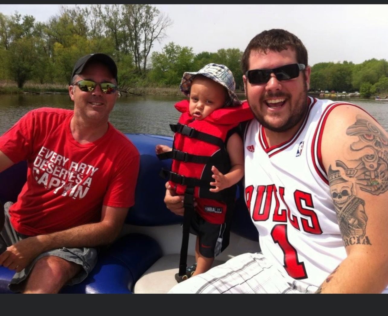 Grandpa taking Trenton on his first boat ride!