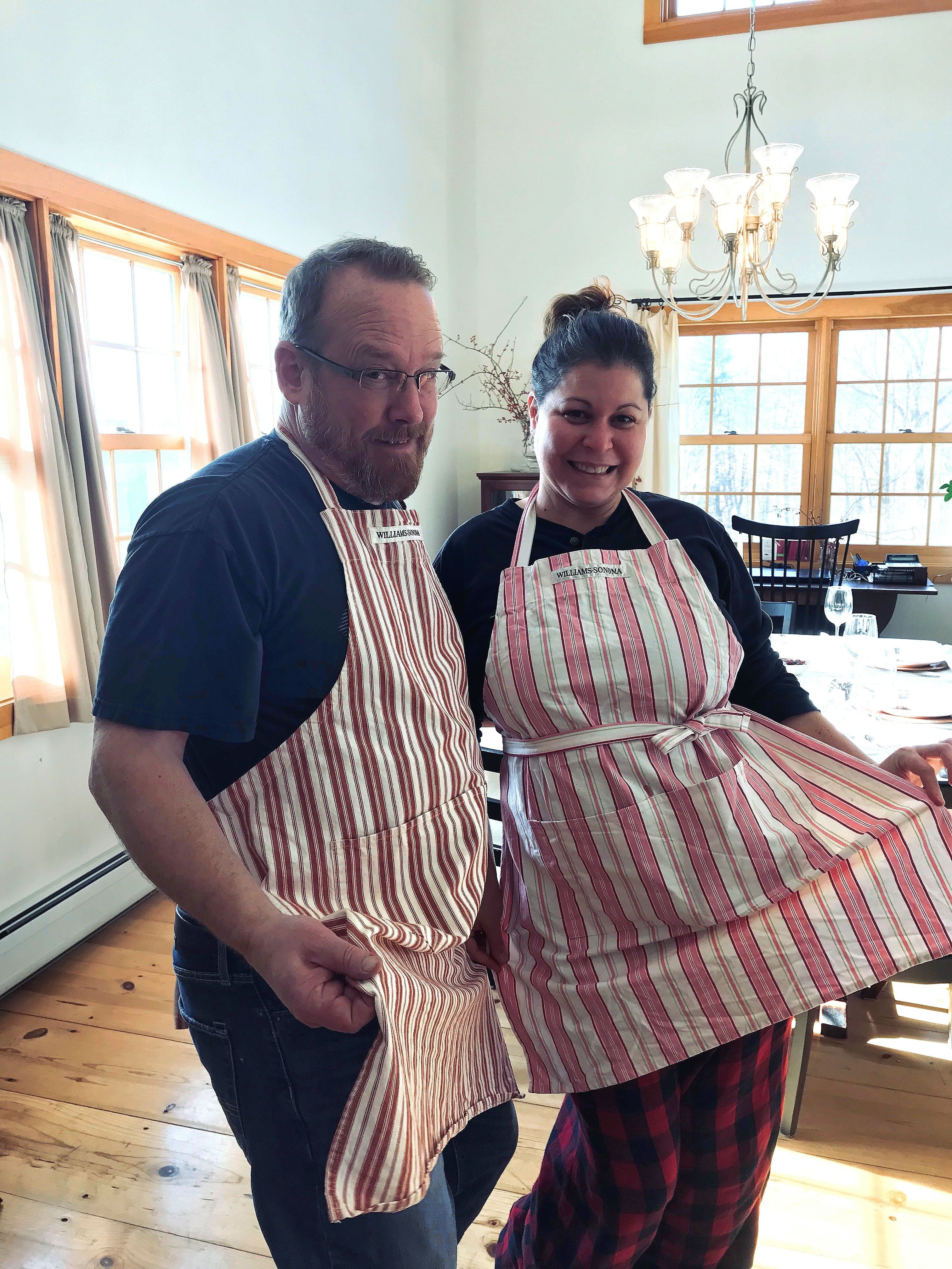 Matching aprons with my mother and her husband Mike.