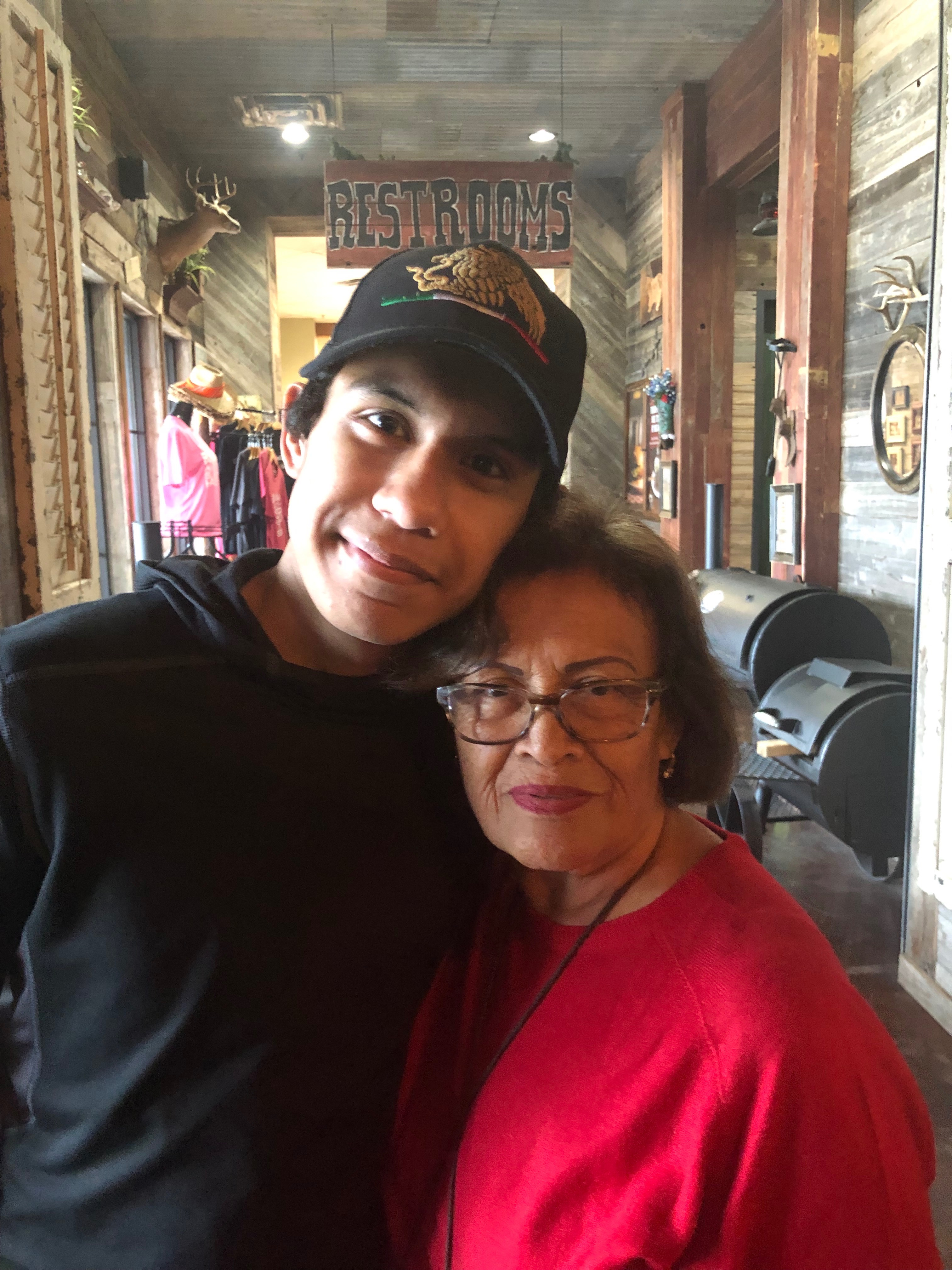 Mom and Omar having BBQ in Pearland