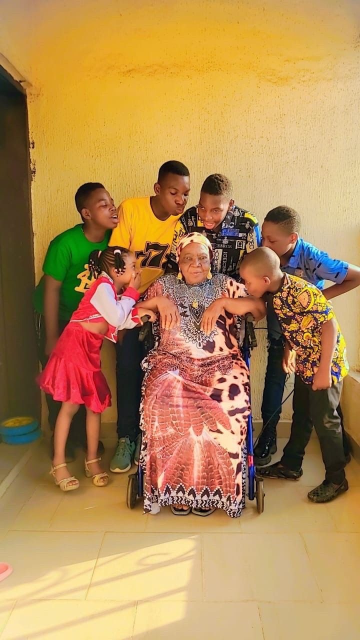 Mama with some of her grand-children, Chinemerem, Chimezie, Chibuike, Chimdi, Chukwunyerem and Chimamanda.