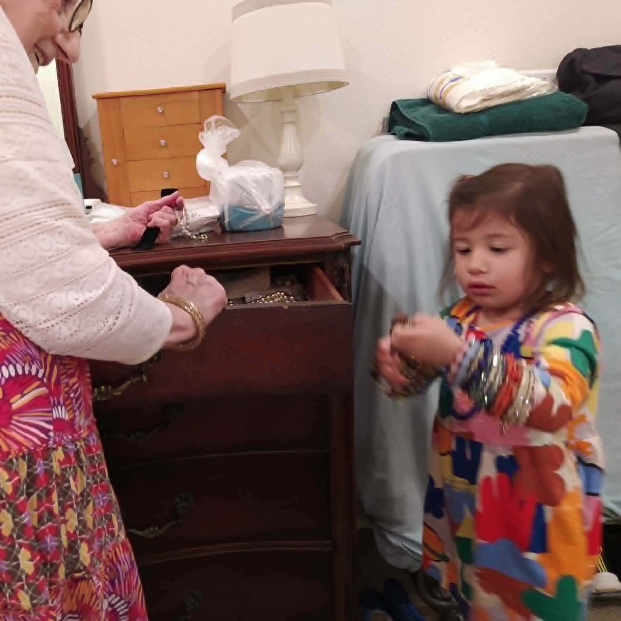 Great grandaughter Athena trying on Nonna's jewelry.