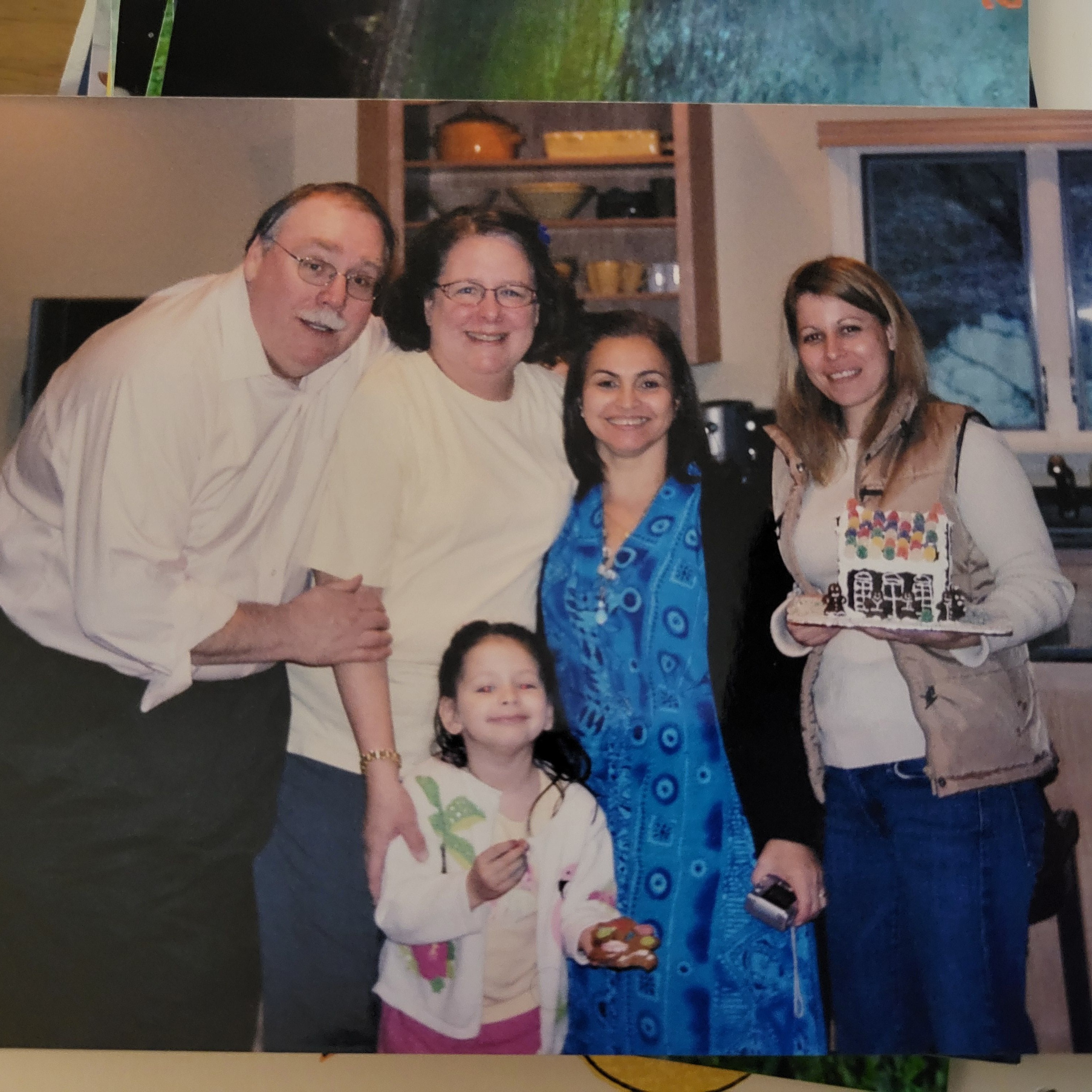 Above is a photo when my mother, my honorary grandparents and aunt came to visit us in America. I was the youngest in the photo, and I will always cherish this memory.