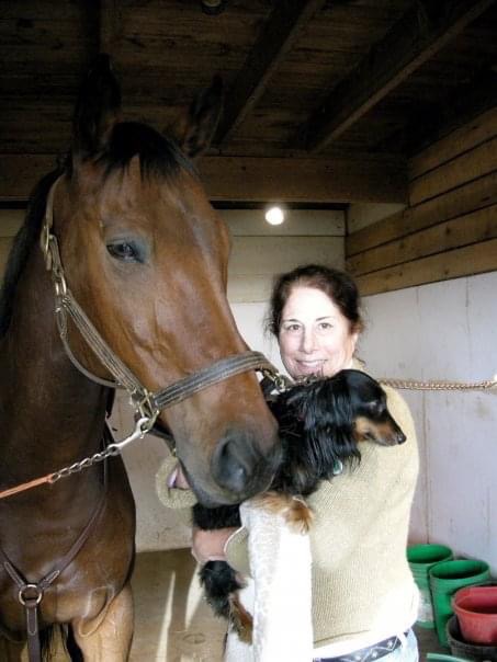 Here she is with Ozzie and her horse, Silent Reverie (Rev, for short). Reverie is, if you can believe it, still running around the fields of Maryland at the ripe age of 35!