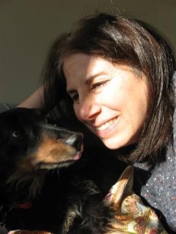 My mom loved her pets so much. Here she is with Ozzie, the first dog after many years with only cats. He was a spunky miniature long haired dachshund and he loved her so much.